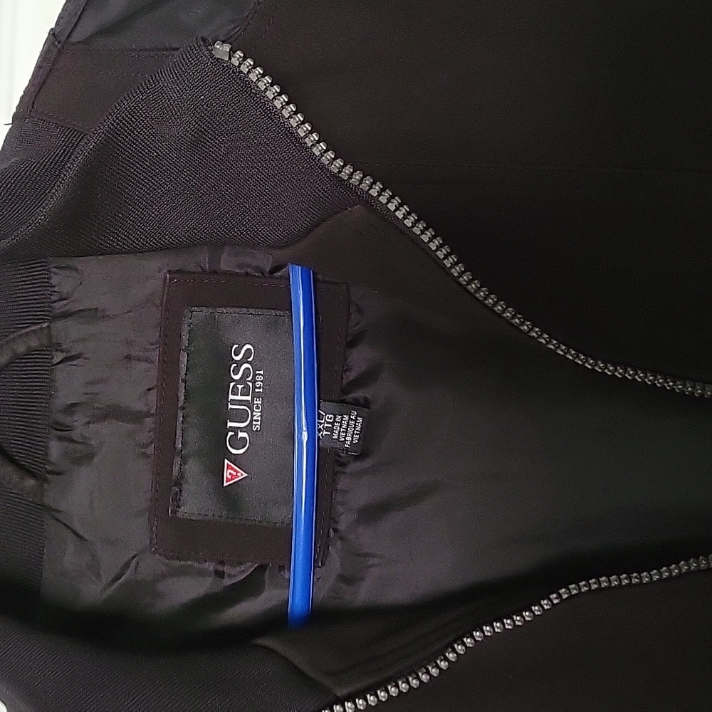 Guess black jacket. Worn a few times. Excellent condition.